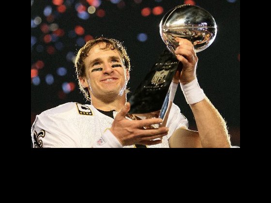 Drew Brees holding the Lombardi trophy in 2010(photo by Andy Lyons/Getty Images)
