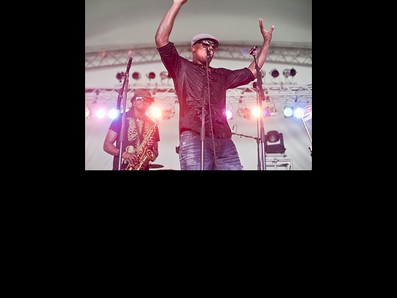 Big Sam of Big Sam's of Funk Nation at Jazz Fest. Photo by Todd Geasland