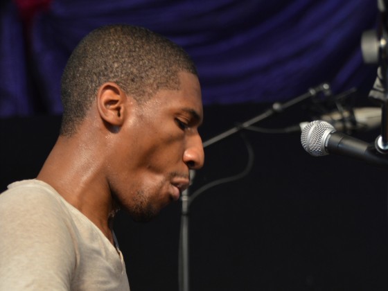 Jon Batiste performing at Jazz Fest 2014 [Photo by Kichea S. Burt]