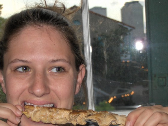 The author savoring the chicken skewer