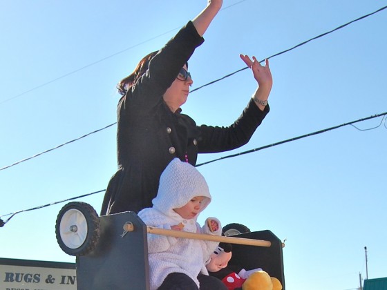 Bead-mongering mom atop ladder with basket labeled - we take donations