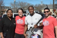Winner of Silvertone electric guitar donated by New Orleans Music Exchange at an event in 2015