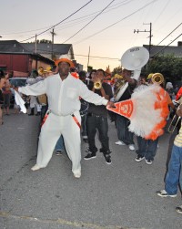 Front shot of Ed Buckner with the brass band behind him.